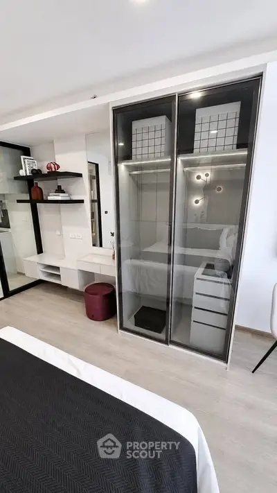 Modern bedroom with sleek wardrobe and stylish decor