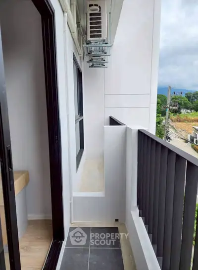 Modern balcony with sleek railing and scenic view