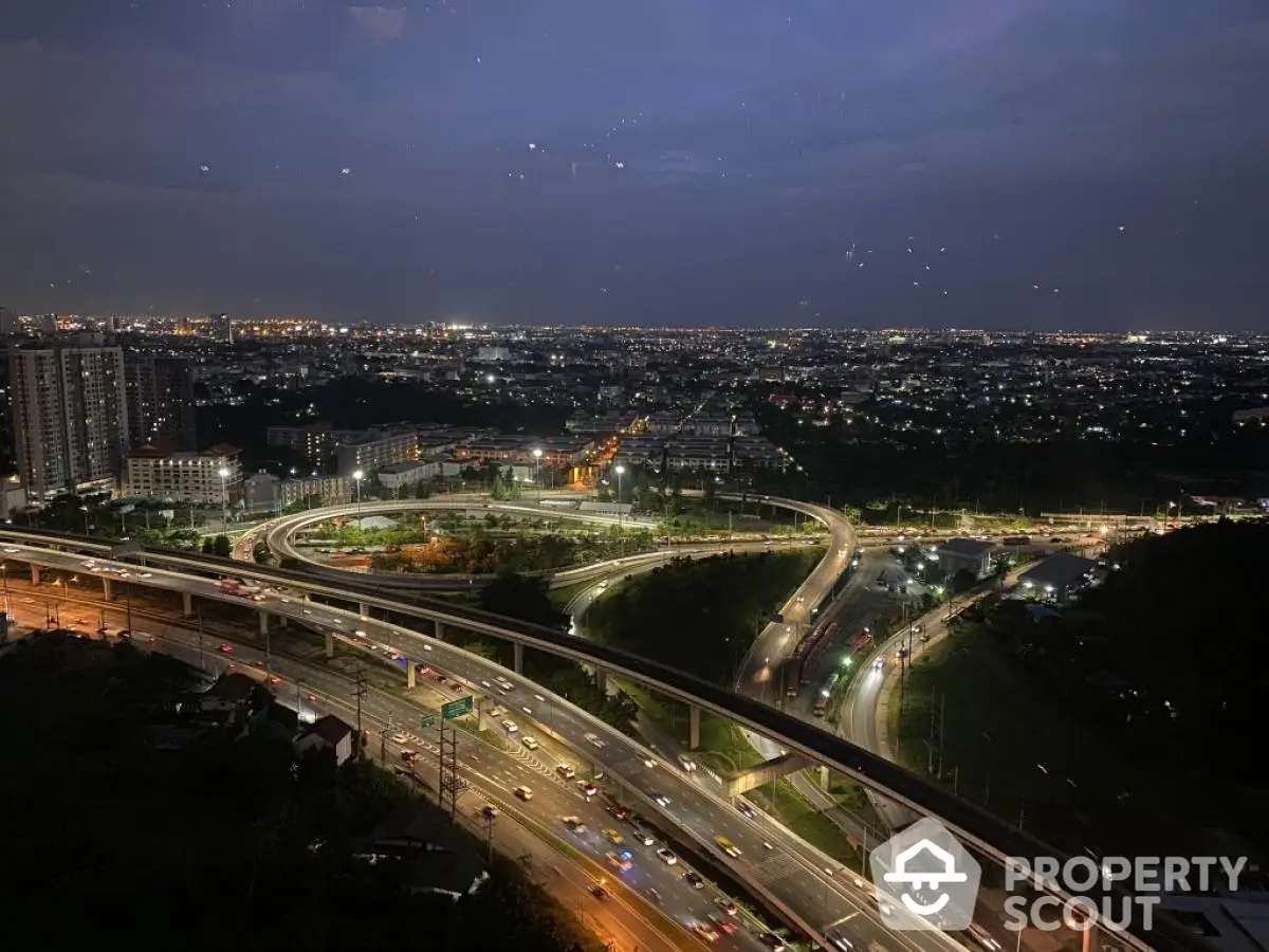 Stunning cityscape view with illuminated highways and urban skyline at night