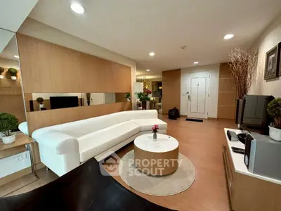 Modern living room with stylish decor and comfortable seating in a cozy apartment.