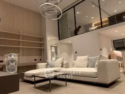 Luxurious modern living room with elegant sofa and stylish lighting in a contemporary apartment.
