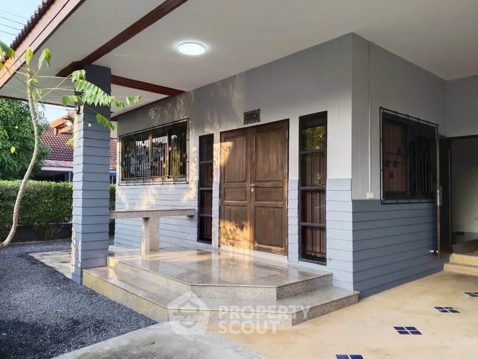 Charming modern home entrance with sleek design and inviting steps