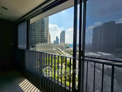 Stunning city view from a modern balcony with sleek railing design, perfect for urban living.