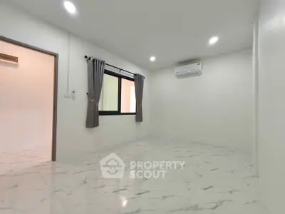 Spacious modern living room with marble flooring and air conditioning