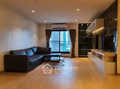 Spacious modern living room with city view and sleek furniture