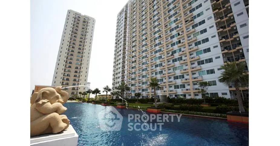 Luxurious high-rise apartment complex with stunning pool and landscaped gardens.