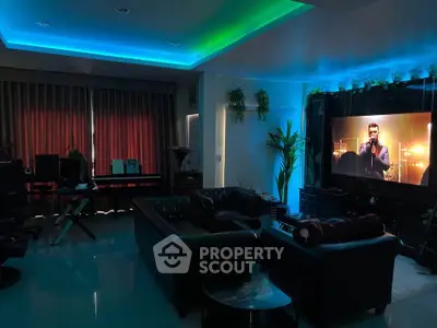 Modern living room with ambient lighting and large TV screen