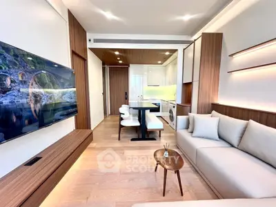 Modern living room with sleek design, open kitchen, and stylish furniture in a contemporary apartment.