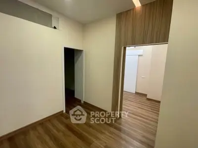Spacious room with wooden flooring and modern design