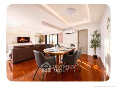 Spacious living room with elegant dining area and modern decor