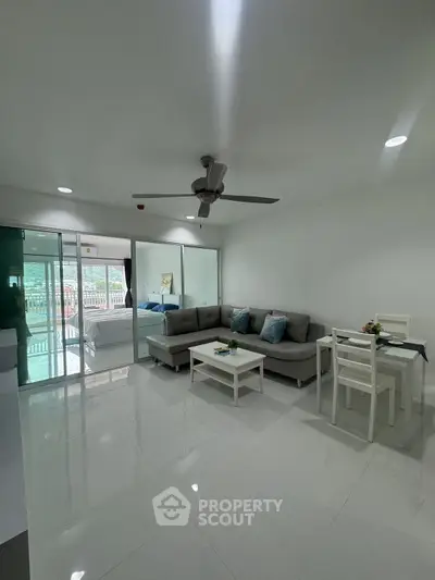 Spacious modern living room with sleek design and large windows for natural light.
