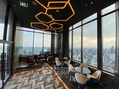 Luxurious high-rise lounge with panoramic city views and modern lighting