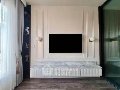 Elegant living room with modern TV setup and stylish decor