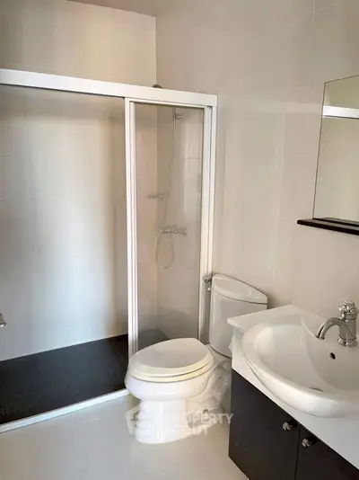 Modern bathroom with sleek shower and elegant fixtures