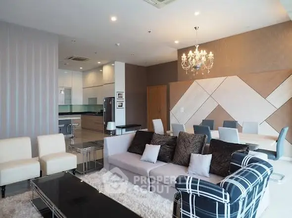 Spacious modern living room with elegant decor and open kitchen layout