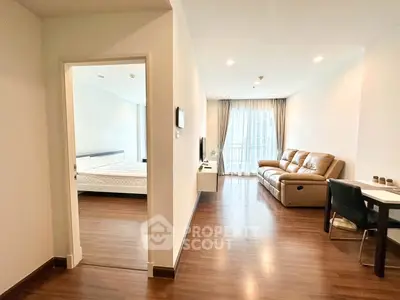 Modern apartment interior with cozy living room and bedroom view