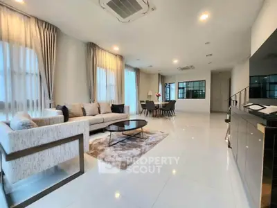Spacious modern living room with elegant decor and ample natural light