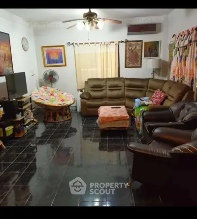 Spacious living room with cozy seating and modern decor