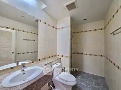 Spacious modern bathroom with sleek design and neutral tones