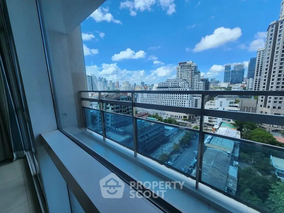 Stunning cityscape view from a modern high-rise balcony, perfect for urban living enthusiasts.