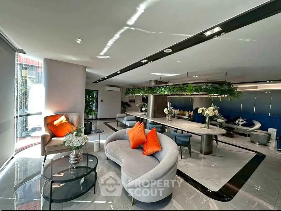 Luxurious modern living room with elegant decor and vibrant accents