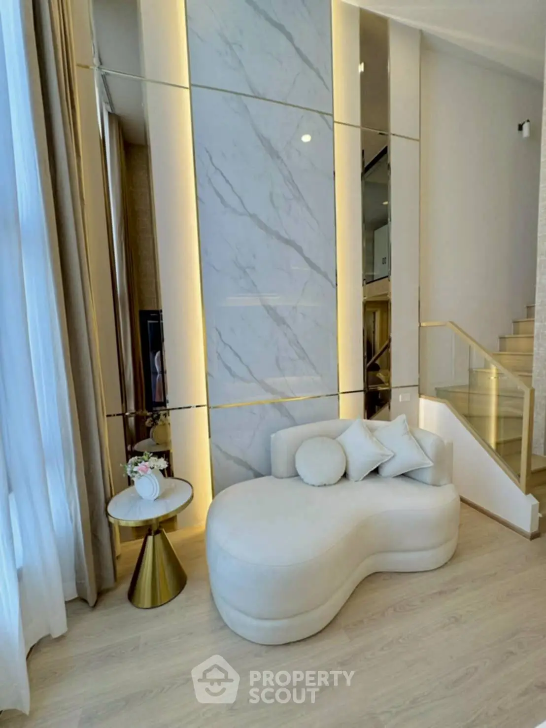 Luxurious modern living room with elegant marble wall and stylish furniture