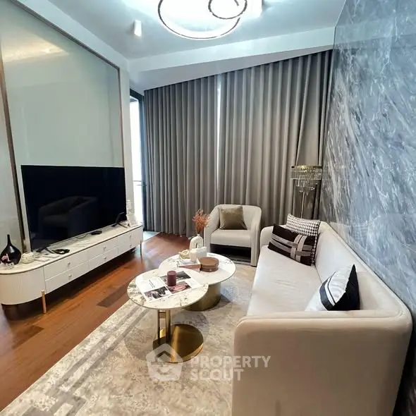 Luxurious modern living room with elegant decor and large TV