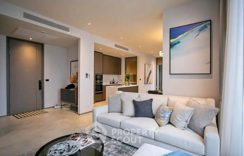 Modern open-plan living room with stylish decor and cozy seating area