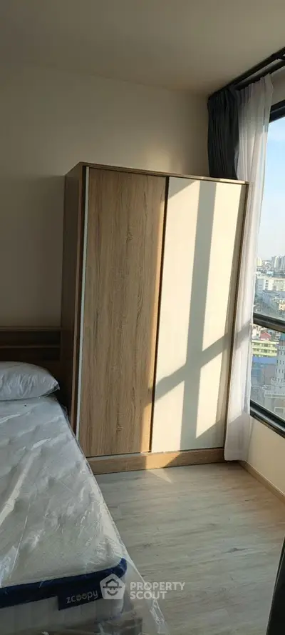 Spacious modern living room with large windows and natural light