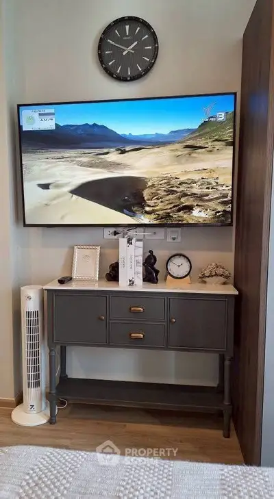 Stylish living room corner with wall-mounted TV and elegant console table