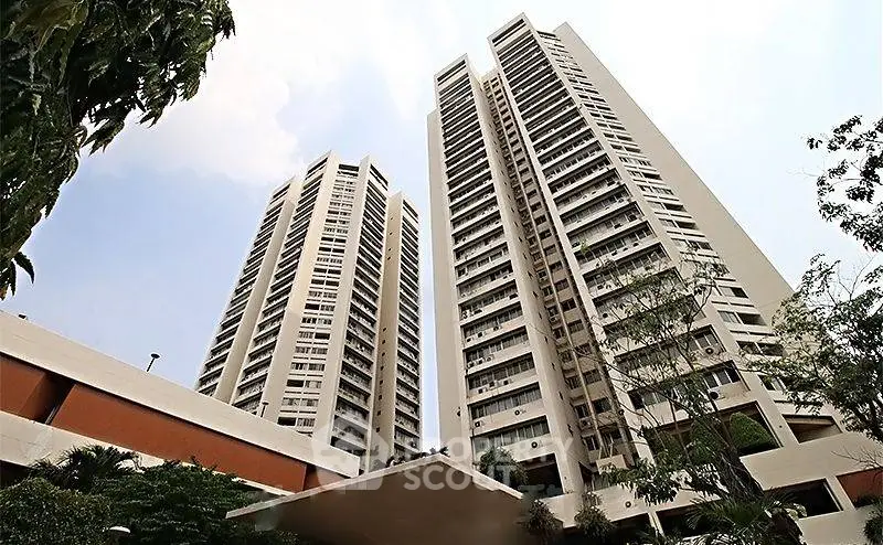 Stunning high-rise residential towers with modern architecture and lush greenery.