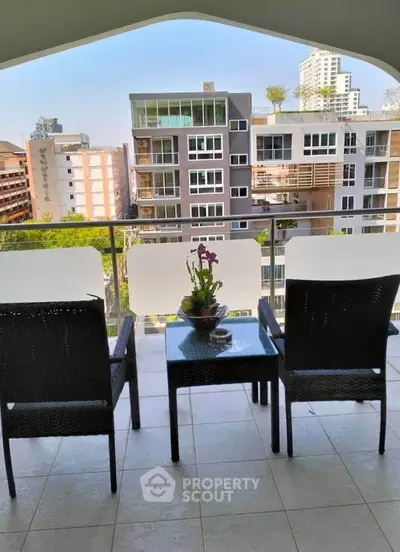 Spacious balcony with city view, perfect for relaxation and enjoying urban living.