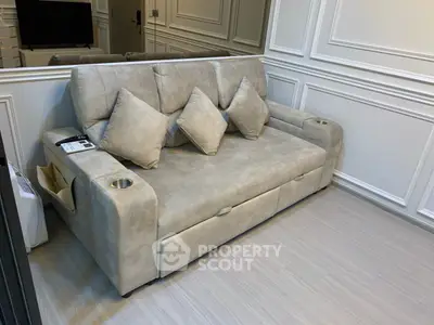 Luxurious living room with elegant beige sofa and stylish wall paneling