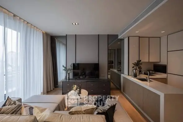 Modern living room with open kitchen and stylish decor