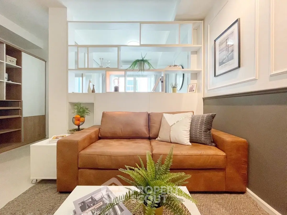 Stylish living room with brown leather sofa and modern decor