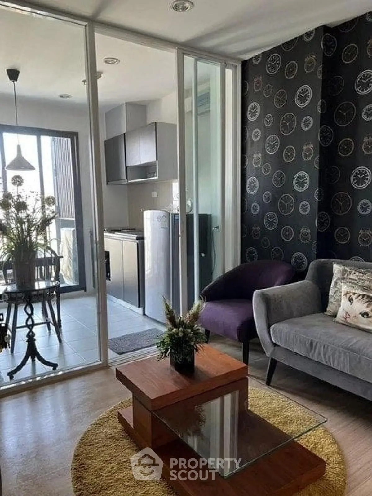 Stylish modern living room with glass partition and cozy decor