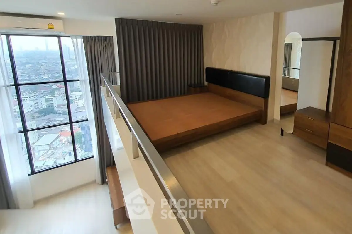 Spacious modern bedroom with city view and stylish wooden flooring