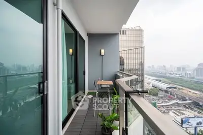 Modern apartment balcony with city view and stylish decor