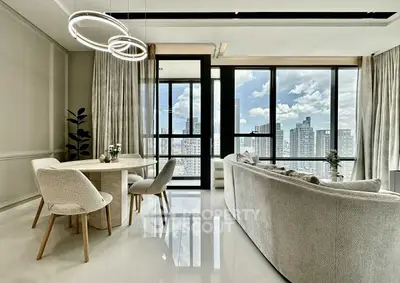 Luxurious modern living room with panoramic city view and elegant decor