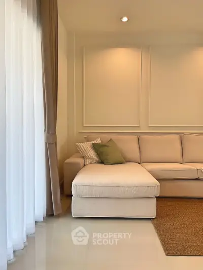 Elegant living room with cozy beige sofa and soft lighting