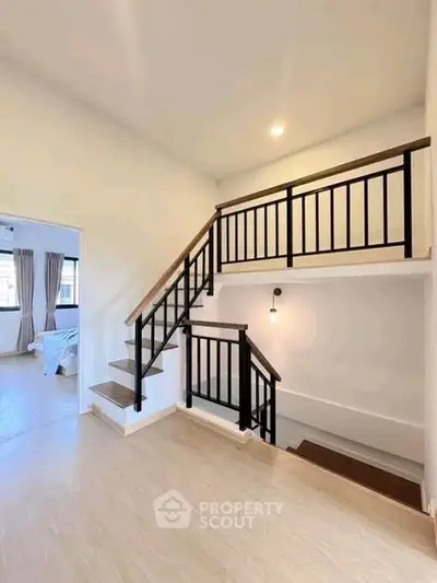 Modern duplex interior with stylish staircase and bright natural lighting