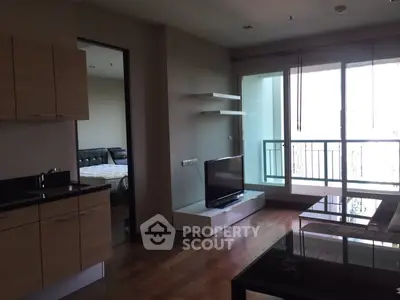 Modern apartment living room with balcony and sleek furnishings
