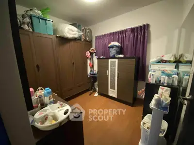 Spacious storage room with ample cabinets and organized shelving