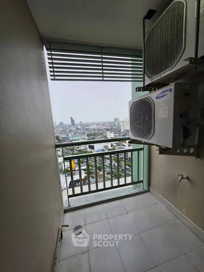 High-rise balcony with city view and air conditioning units, perfect for urban living.