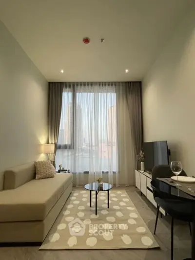 Modern living room with stylish decor and city view, featuring a cozy sofa and sleek TV setup.