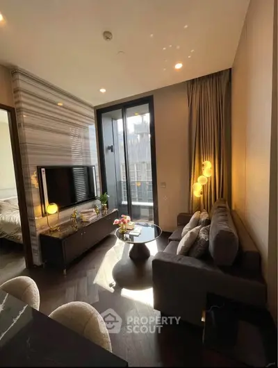 Luxurious modern living room with elegant decor and natural light, featuring a cozy sofa and stylish lighting.