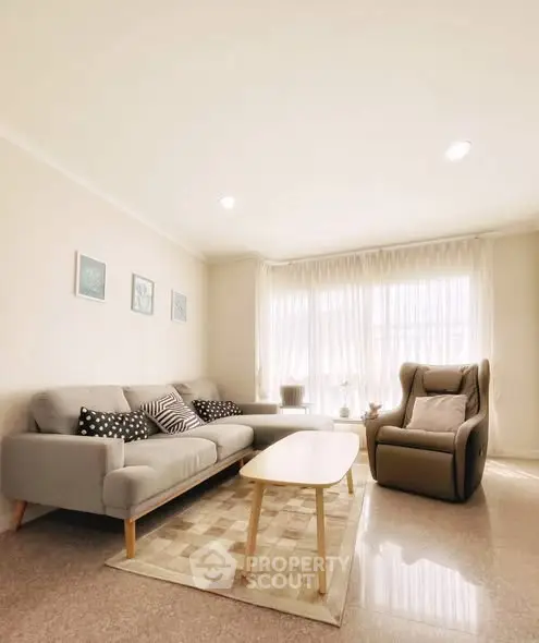 Bright and cozy living room with modern furniture and natural light.