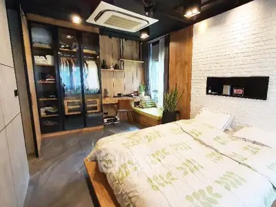 Modern bedroom with stylish decor and built-in wardrobe