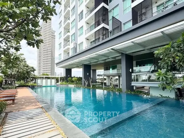 Luxurious condominium with stunning pool and modern architecture