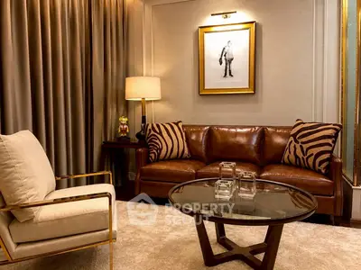 Luxurious living room with leather sofa, elegant decor, and ambient lighting.